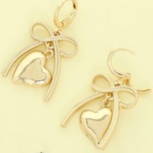 849. Long bow and heart dangle earring gold tone